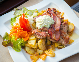 Wall Mural - Traditional Bavarian pork steak with potato.