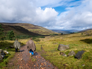 two girls hiking through a beautiful scottish valley