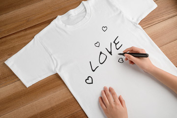 Girl drawing LOVE and hearts