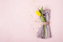 Spring Easter Table Setting. Cutlery Is Decorated With Beautiful Yellow Tulip Flower