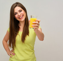 Smiling Woman Holding Orange Juice Glass.