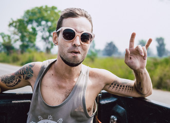 Wall Mural - young man with sunglasses