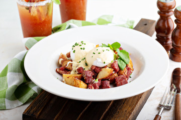 Breakfast potatoes with eggs Benedict and corned beef