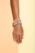 © 5second - Female hand with bracelets on colorful background