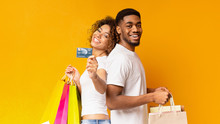 Young Black Couple With Shopping Bags And Credit Card