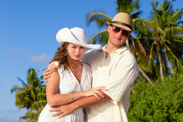 happy couple on tropical beach vacation