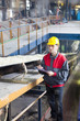 © Avatar_023 - Transport of sugar on the production line , worker writes the quality information