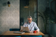 © cherryandbees - mourning routine. businessman reading newspapers on coffee break in cafe bar