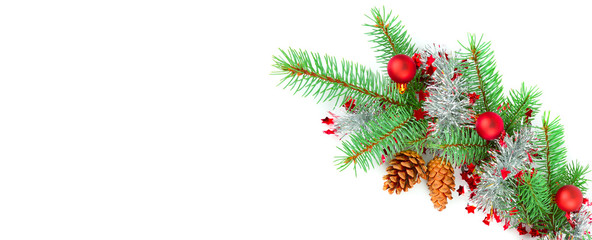 Christmas decoration baubles with branches of fir tree on white. Free space for text. Wide photo.