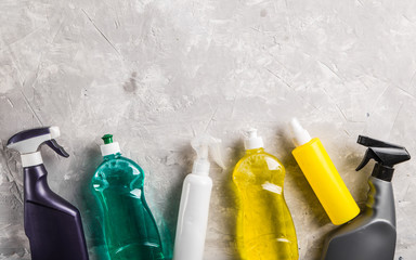 flat lay composition with cleaning supplies for dish washing and space for text on grey background