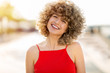 © pikselstock - Portrait of young woman with curly hair