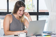 © Mego-studio - Woman working on laptop at home.