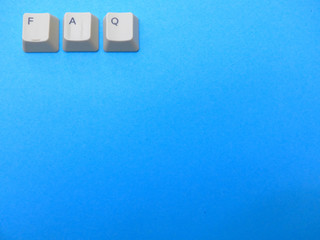 Aufkleber - Computer buttons form a FAQ (frequently asked questions) abbreviation. Computer and internet slang, background.