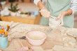 © Seventyfour - Closeup portrait of unrecognizable female artist shaping clay while working in pottery workshop, copy space
