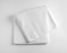 Folded Soft Terry Towel On Light Background, Top View