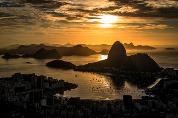 Wall Mural - Golden Sunrise over Guanabara Bay in Rio de Janeiro with Sugarloaf Mountain in the Horizon