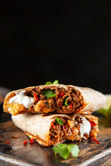 Wall Mural - Mexican burrito with beef, beans and sour cream