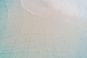 Aerial view background of white sand beach wave turquoise sea water