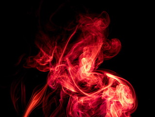 Red smoke on black background