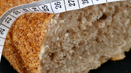 Wall Mural - healthy bran bread and tape measure, whole wheat bread,