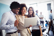 © NDABCREATIVITY - Programmers cooperating at IT company developing apps