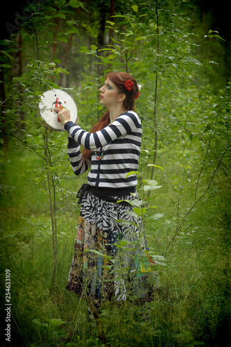 Fotomural gypsy with a tambourine in the forest