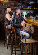 © be free - Weekend lifestyle. Guy bearded man sit at bar counter in pub. Pub great place to dine drink and have fun. Hipster relaxing at pub. Man with beard spend leisure in dark pub. Brutal hipster relaxing