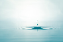 Water Droplets On Surface Water Background