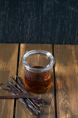 Poster - vanilla extract on wooden surface