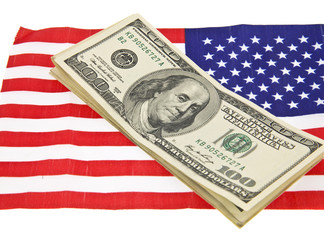 Wall Mural - dollars on usa flag isolated on white background