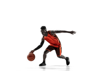 full length portrait of a basketball player with a ball isolated on white studio background. adverti
