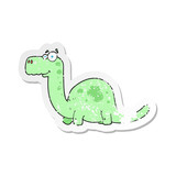 Fototapeta Dinusie - retro distressed sticker of a cartoon dinosaur