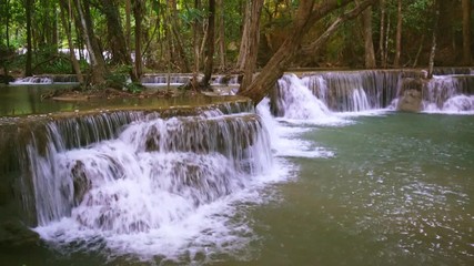 Wall Mural - Waterfall flow standing with forest enviroment view in thailand called Huay or Huai mae khamin in Kanchanaburi Provience, Thailand., Lockdown.
