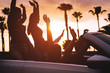© Alessandro Biascioli - Group of friends having fun in convertible car during road trip at sunset - Young travel people driving a cabriolet during summer holidays - Happiness, vacation and youth lifestyle concept