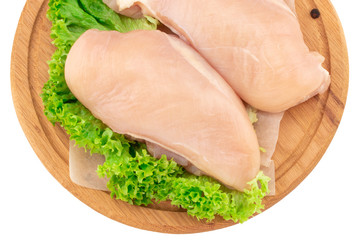  Raw chicken breast fillets on wooden cutting board isolated on white background