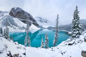first snow morning at moraine lake in banff national park alberta canada snow-covered winter mountai