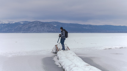 Wall Mural - Photographer With Winter Landscape