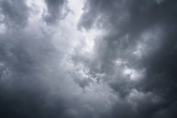 Wall Mural - dark, grim, stormy, rainy sky with rays of light. scary hurricane clouds. natural element. stock pho
