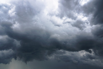 Wall Mural - dark, grim, stormy, rainy sky with rays of light. scary hurricane clouds. natural element. stock pho