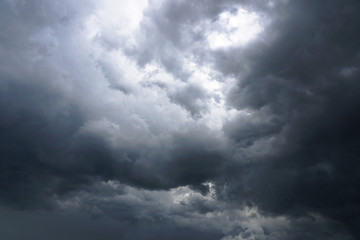 Wall Mural - dark, grim, stormy, rainy sky with rays of light. scary hurricane clouds. natural element. stock pho
