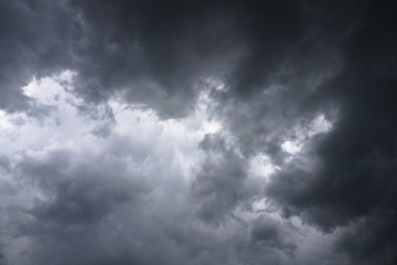 Wall Mural - dark, grim, stormy, rainy sky with rays of light. scary hurricane clouds. natural element. stock pho