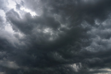 Wall Mural - dark, grim, stormy, rainy sky with rays of light. scary hurricane clouds. natural element. stock pho