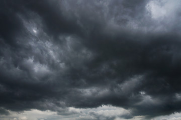 Wall Mural - dark, grim, stormy, rainy sky with rays of light. scary hurricane clouds. natural element. stock pho