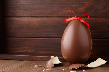 Wall Mural - Chocolate Easter egg gift with red bow