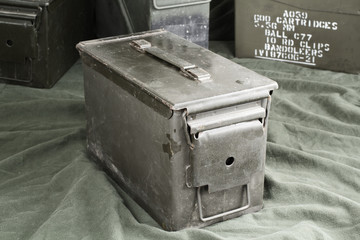 Military green ammunition boxes.