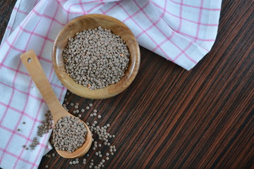 raw gray lentils in a bowl