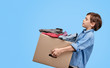© kegfire - Boy carrying box with things for charity