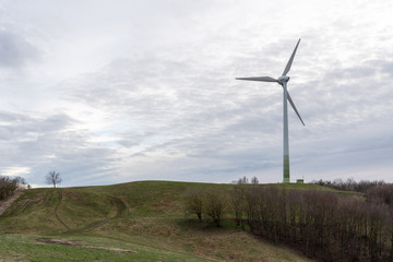 Wind turbine, renewable energy generation in green landscape near Munich, Germany