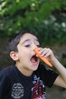 © Anelik - Playful boy making nose with peeled carrot