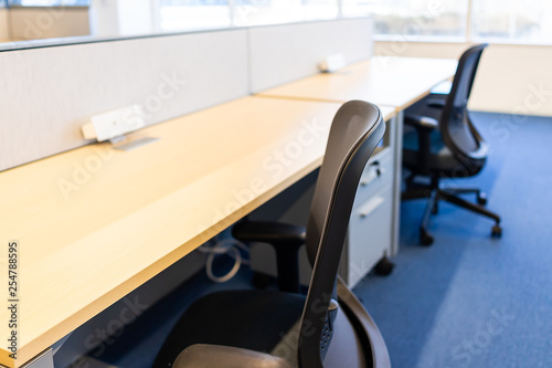 Empty Office Room With Closeup Of Chair Wooden Table And